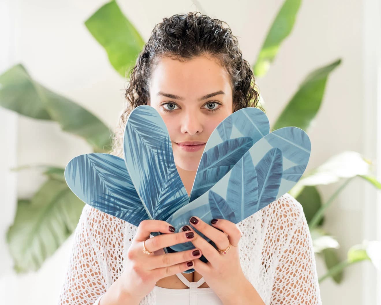 Fusion Family Recovery - Woman holding leaf-patterned sandals
